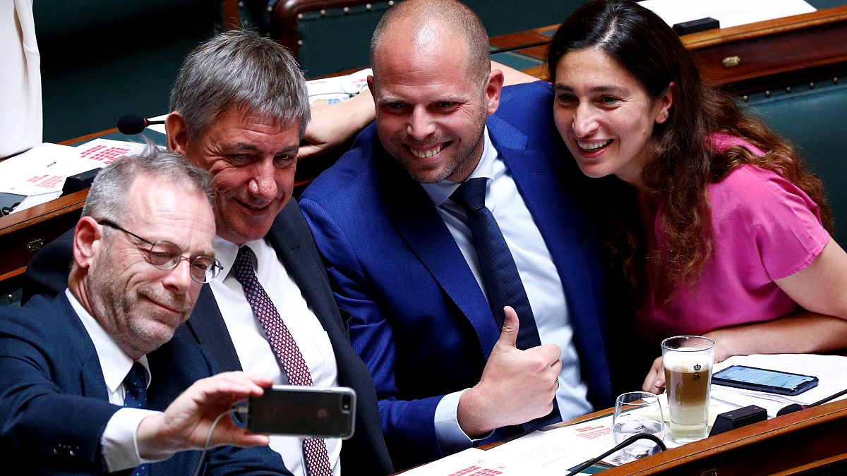 N-VA party members De Roover, Jambon, Francken and Demir pose for a selfie during a plenary session of the Belgian Parliament in Brussels