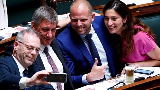 N-VA party members De Roover, Jambon, Francken and Demir pose for a selfie during a plenary session of the Belgian Parliament in Brussels