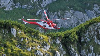 Mountain rescue team (TOPR) helicopter is pictured in Tatra mountains during a search mission to save two cavers trapped in a cavern near Zakopane, Poland August 19, 2019.