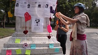 A group of Mexican women knit hearts to honour the memory of those murdered