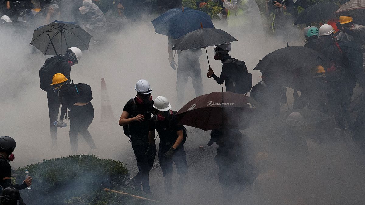 Anti-extradition bill protesters are surrounded by tear gas during clashes with police in Tsuen Wan in Hong Kong, China August 25, 2019. Picture taken August 25, 2019.