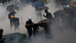Anti-extradition bill protesters are surrounded by tear gas during clashes with police in Tsuen Wan in Hong Kong, China August 25, 2019. Picture taken August 25, 2019.