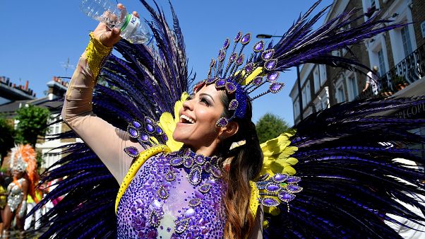 Notting Hill Carnival parade performer in the heat Notting Hill Carnival parade performer in the heat
