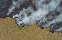 An aerial view shows smoke rising over a deforested plot of the Amazon jungle in Porto Velho, Rondonia State, Brazil, in this August 24, 2019 picture taken with a drone.