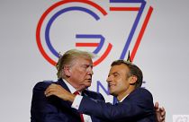 French President Emmanuel Macron greets U.S. President Donald Trump after a joint press conference at the end of the G7 summit in Biarritz, France, August 26, 2019. 