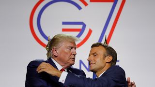 French President Emmanuel Macron greets U.S. President Donald Trump after a joint press conference at the end of the G7 summit in Biarritz, France, August 26, 2019. 