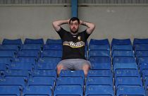 Bury fan, at their ground Gigg lane, after finding out their takeover deal fell through