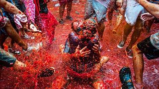 Watch live: Thousands hurl fruit at La Tomatina festival