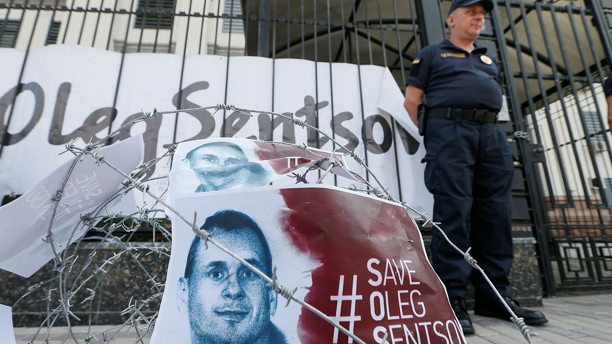 Barbed wire and placards with images of Ukrainian film director Oleg Sentsov are seen after a rally demanding the release of Sentsov