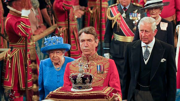 Britain's Queen Elizabeth and Prince Charles walk through the Royal Gallery during the State Opening of Parliament in central London Britain's Queen Elizabeth and Prince Charles walk through the Royal Gallery during the State Opening of Parliament in central London