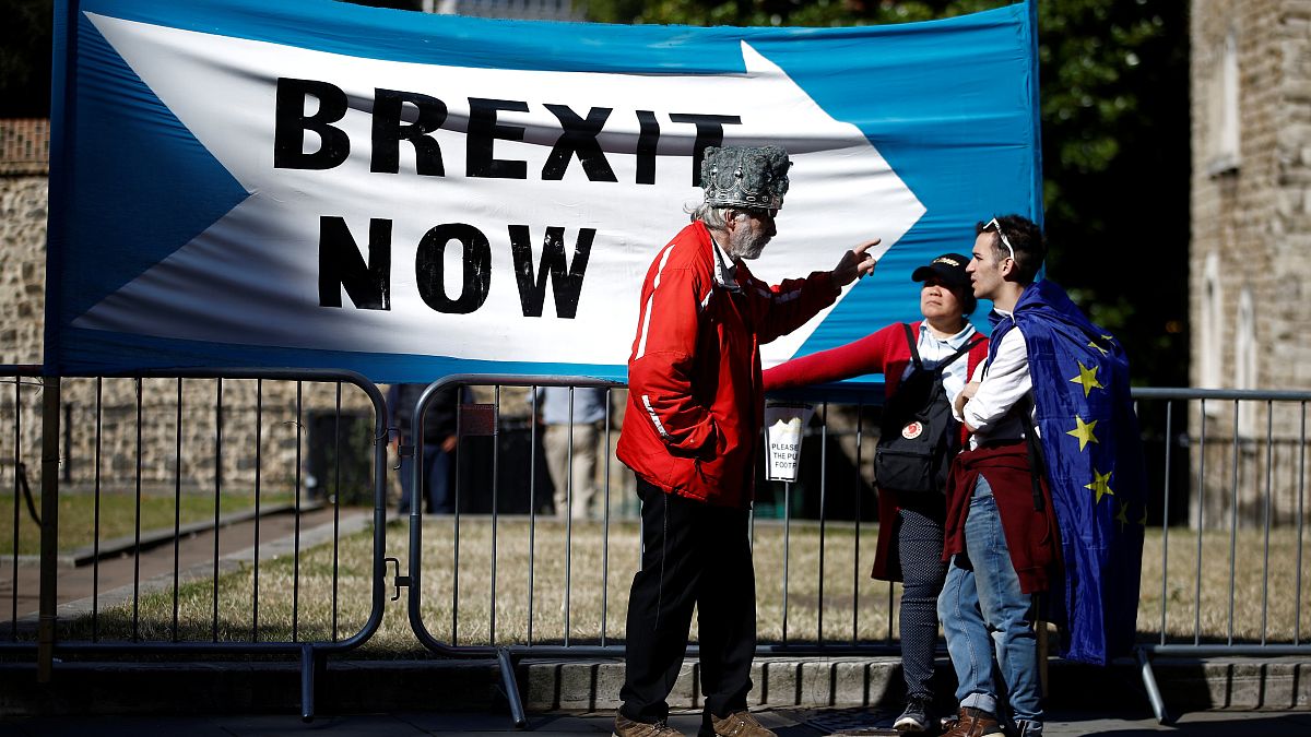 A Pro-Brexit protester talks with anti-Brexit protesters in London, Britain, September 2, 2019. 
