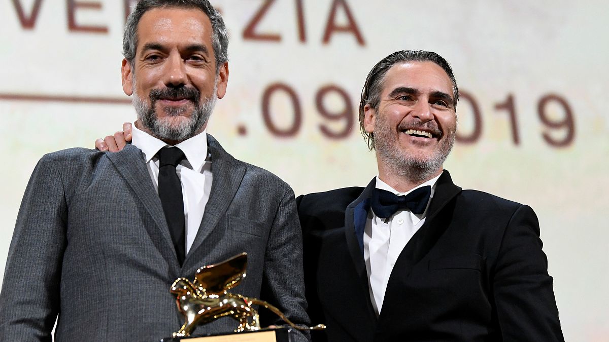 Director Todd Phillips poses next to Joaquin Phoenix after winning the Golden Lion for Best Film in Venice, Italy on September 7, 2019.