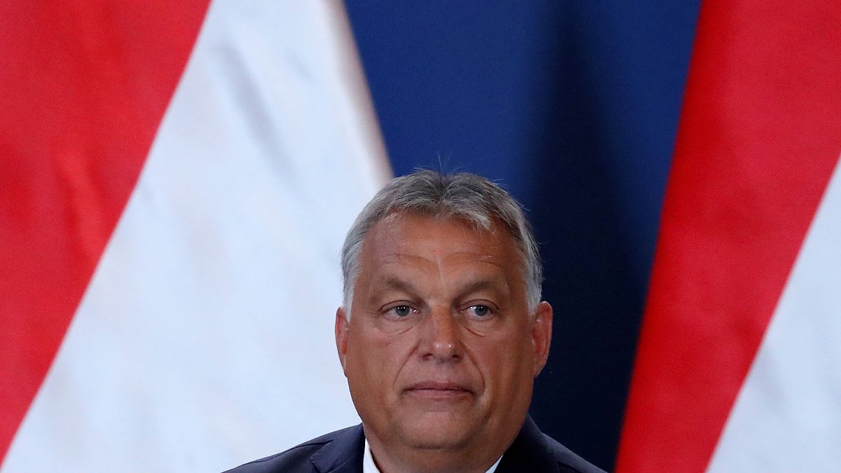 Hungarian Prime Minister Viktor Orban reacts during a news conference with German Chancellor Angela Merkel (not pictured) as they visit the Hungarian border town of Sopron.