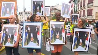 Watch: Climate protesters on trial over Macron portraits