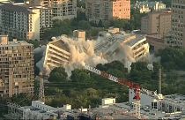 Drone footage shows bank building imploding in Dallas, Texas