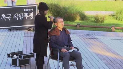 South Korea opposition leader shaves head in protest