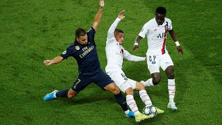 Real Madrid's Eden Hazard in action with Paris St Germain's Marco Verratti and Idrissa Gueye