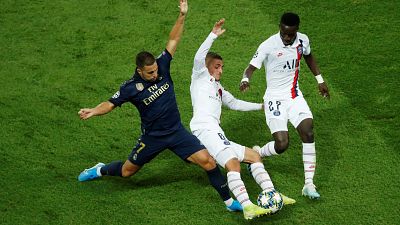 Real Madrid's Eden Hazard in action with Paris St Germain's Marco Verratti and Idrissa Gueye