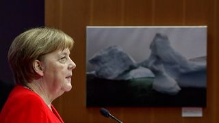 German Chancellor Angela Merkel delivers a spech at the start of the second day of the 10th Petersberger Klimadialog climate conference