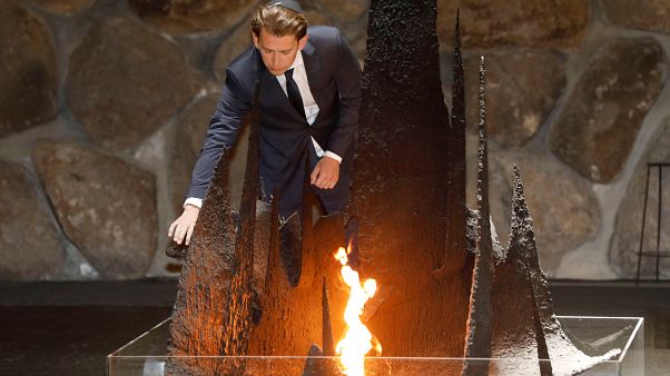 FILE PHOTO: Austrian Chancellor Sebastian Kurz rekindles the eternal flame during a Holocaust commemoration, Jerusalem, June 2018 FILE PHOTO: Austrian Chancellor Sebastian Kurz rekindles the eternal flame during a Holocaust commemoration, Jerusalem, June 2018