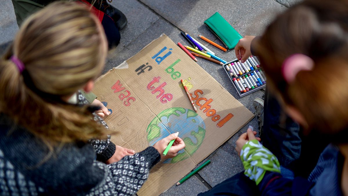 Young activists paint placards during the Fridays for Future global climate strike in Stockholm, Sweden, September 20, 2019.