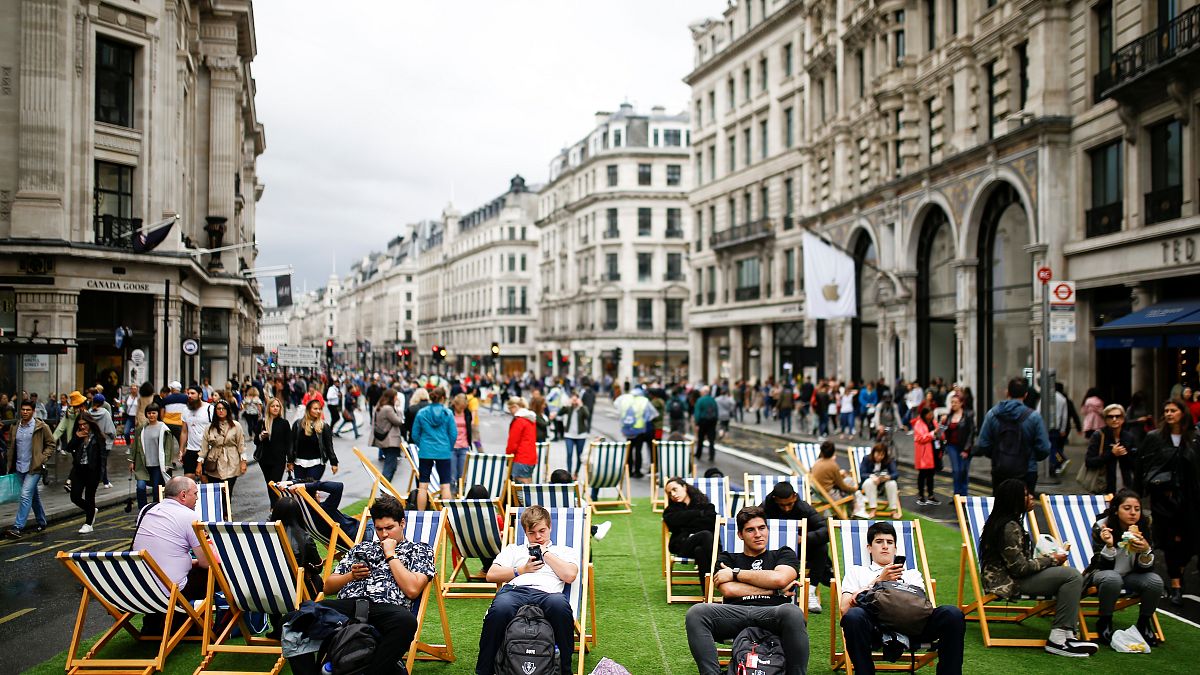 People relax on deck chairs on Regent Street after it was shut as part of 'Car Free Day' in London, Britain, September 22, 2019. 