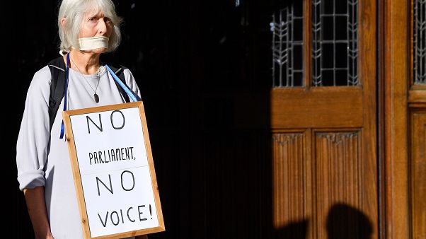 A woman protests outside the Supreme Court of the United Kingdom against Prime Minister Boris Johnson's decision to prorogue parliament, in London, Britain September 17, 2019. A woman protests outside the Supreme Court of the United Kingdom against Prime Minister Boris Johnson's decision to prorogue parliament, in London, Britain September 17, 2019.