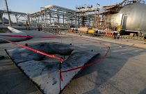 FILE PHOTO: A metal part of a damaged tank is seen at the damaged site of Saudi Aramco oil facility in Abqaiq, Saudi Arabia, September 20, 2019.