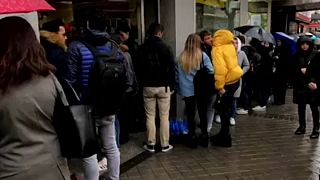 Long queues outside Spanish post offices as postal voters wait in line