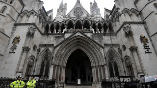 Police officers outside the Royal Courts of Justice in London, UK