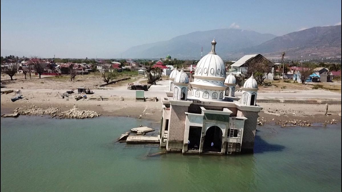 Drone images show damage one year after Indonesia earthquake, tsunami