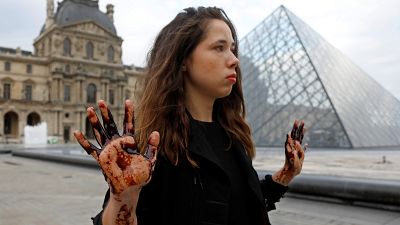Protesters cover Louvre's Pyramid in black treacle