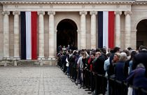 Hundreds waited patiently in the rain to pay tribute to Jacques Chirac