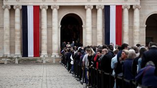 Hundreds waited patiently in the rain to pay tribute to Jacques Chirac