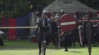 Knights participate in jousting contest on bikes in Berlin