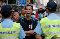Hong Kong police shoot young protester at close range