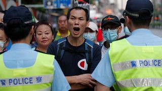 Hong Kong police shoot young protester at close range