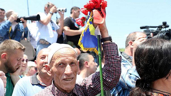 A man holding flags of Albania and Kosovo attends the 20th anniversary of the deployment of NATO Troops in Kosovo in Pristina, Kosovo June 12, 2019. A man holding flags of Albania and Kosovo attends the 20th anniversary of the deployment of NATO Troops in Kosovo in Pristina, Kosovo June 12, 2019.