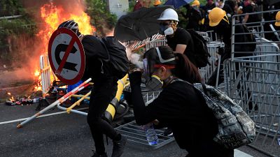 Hong Kong police break up protests in day of violence