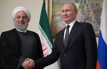 الرئيس الروسي فلاديمير بوتين ونظيره الإيراني حسن روحاني