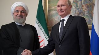 الرئيس الروسي فلاديمير بوتين ونظيره الإيراني حسن روحاني