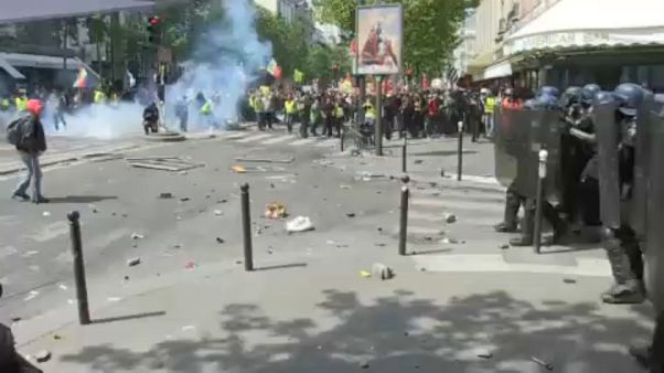 Violence erupts at Paris May Day march as protesters clash with police Violence erupts at Paris May Day march as protesters clash with police