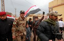 December 14, 2016 - Lieutenant General Abdelwahab al-Saadi (C) walks with children as they celebrate in Qadisiyah neighborhood north of Mosul, Iraq, December 14, 2016