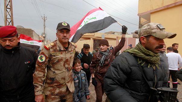 December 14, 2016 - Lieutenant General Abdelwahab al-Saadi (C) walks with children as they celebrate in Qadisiyah neighborhood north of Mosul, Iraq, December 14, 2016 December 14, 2016 - Lieutenant General Abdelwahab al-Saadi (C) walks with children as they celebrate in Qadisiyah neighborhood north of Mosul, Iraq, December 14, 2016