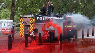 Extinction Rebellion: Climate activists fire hundreds of gallons of fake blood at the UK's Treasury