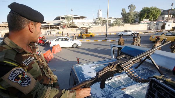 Irak'ın başkenti Bağdat'ta bir kontrol noktası Irak'ın başkenti Bağdat'ta bir kontrol noktası