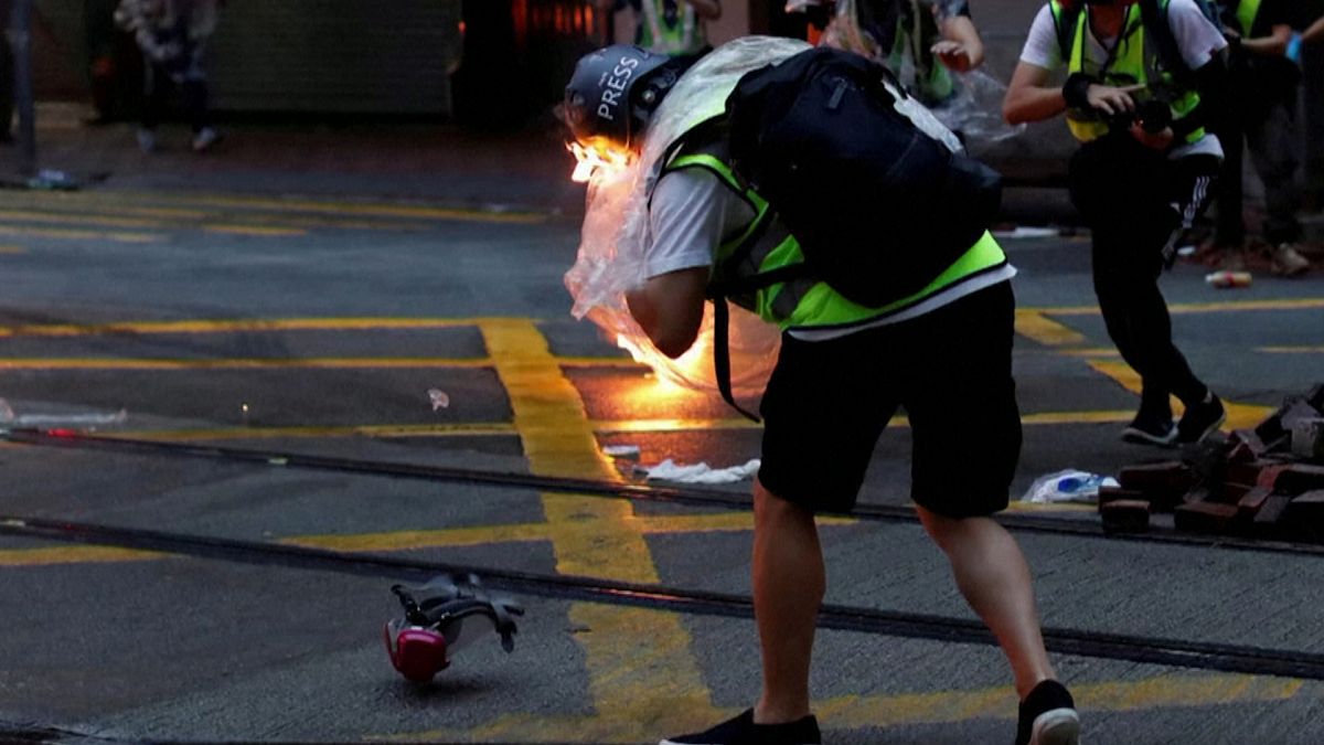 Journalist hit by petrol bomb as Hong Kong protesters defy emergency law