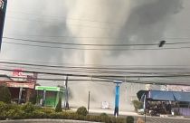 Blustering gustnado in Thailand picks up roofs and signs
