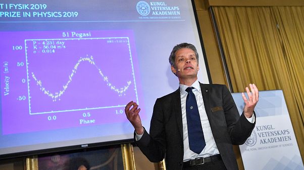 Ulf Danielsson, member of the Nobel committe announces the winners of the 2019 Nobel Prize in Physics during a news conference at the Royal Swedish Academy of Sciences. Ulf Danielsson, member of the Nobel committe announces the winners of the 2019 Nobel Prize in Physics during a news conference at the Royal Swedish Academy of Sciences.