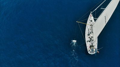 Here the trawler that catches ocean plastic for research can be seen next to the ship Here the trawler that catches ocean plastic for research can be seen next to the ship